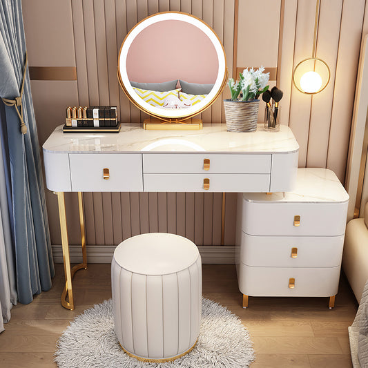 Classic curved upholstered cream-themed makeup vanity with a round stool set